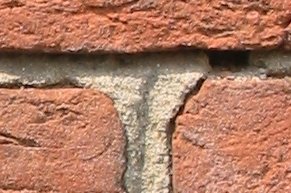 Archivo:Three old bricks held together with mortar