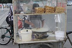 Jianbing being prepared by a street vendor.jpg