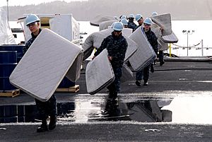 Archivo:Flickr - Official U.S. Navy Imagery - Sailors move mattresses across the flight deck.