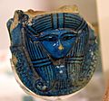 Hathor's head. Faience, from a sistrum's handle. 18th Dynasty. From Thebes, Egypt. The Petrie Museum of Egyptian Archaeology, London
