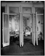 FIRST FLOOR, ENTRANCE HALL, LOOKING SOUTH INTO LIBRARY THROUGH ETCHED GLASS DOORS - Armour-Stiner House, 45 West Clinton Avenue, Irvington, Westchester County, NY HABS NY,60-IRV,3-20