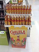 Different sorts of Cholula hot sauce in a supermarket
