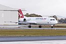 Network Aviation (VH-NHP) Fokker 100, in new Qantaslink "new roo" livery, taxiing at Wagga Wagga Airport.jpg