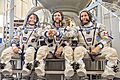 Soyuz MS-09 backup crew in front of the Soyuz spacecraft mockup