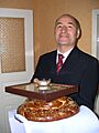 Stas's father presents bread, salt, and an icon