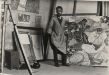 Fernando Leal en su estudio pintando “Campamento de un coronel Zapatista”.png