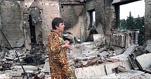 Archivo:Yasynuvata resident standing inside her shelled flat