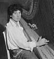 Harpo Marx playing the harp (cropped)
