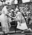 Suzanne Lenglen shaking hands with the Queen, 1926