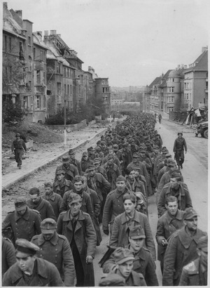 Archivo:The endless procession of German prisoners captured with the fall of Aachen marching through the ruined city streets... - NARA - 541598