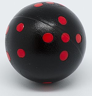Archivo:Black and red round 6-sided die (cropped)
