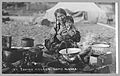 Inuit woman and child cooking outdoors in Nome in 1916