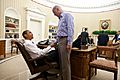 President Barack Obama and Vice President Joe Biden shake hands in the Oval Office following a phone call with House Speaker John Boehner securing a bipartisan deal to reduce the nation's deficit and avoid default