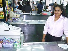 Archivo:Cashier at her register