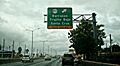 Exit sign for Barrazas, Trujillo Bajo and Santa Cruz barrios in Carolina, Puerto Rico