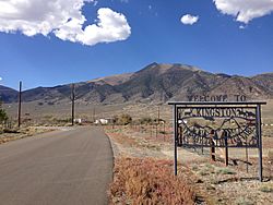 2014-10-08 12 59 44 Sign along Tahoe Road at the entrance to Kingston, Nevada, with Bunker Hill visible in the background.JPG
