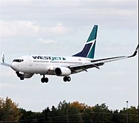 WestJet B737-7CT (C-FGWJ) landing at Regina International Airport