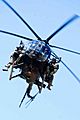 Soldiers from the 75th Ranger Regiment descend in an MH-6 Little Bird