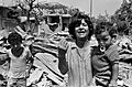 A mother cries in front of destroyed buildings in El Buss camp, Tyre, Lebanon, after the Israeli invasion in June 1982