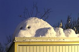 Photograph of a Kilroy was here-style snowman