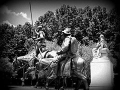 A Black and White Photo of the Bronze sculptures of Don Quixote and Sancho Panza in Madrid Spain