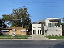 Gentrification with an old and a new home side by side in Old East Dallas
