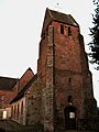 Laigny église fortifiée (façade ouest vue de nuit) 1