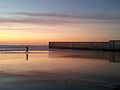 Playas de Tijuana fisherman at border fence