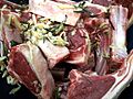 Raw lamb cutlets with shredded ginger and rosemary