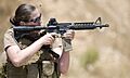US Navy 100714-N-4965F-174 Chief Mass Communication Specialist Paula Ludwick, assigned to Fleet Combat Camera Group Pacific, shoots at a target during a Navy Rifle Qualification Course