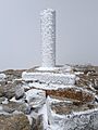 Vértice geodésico con hielo. Peñalara. Sierra de Guadarrama. España. Spain