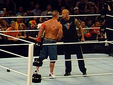 Archivo:Rock and Cena shake hands