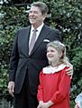 President Reagan with Drew Barrymore at a ceremony launching the Young Astronauts program on the south lawn. October 17, 1984