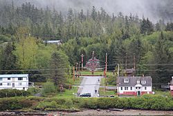 Saxman Alaska totem poles view from boat.JPG