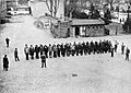 Prisoners guarded by SA men line up in the yard of Sachsenhausen-Oranienburg