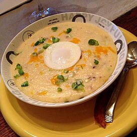 Grits with cheese, bacon, green onion and poached egg.jpg