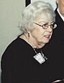 Maryann Mahaffey speaking at 50th anniversary for Henry Messer and Carl House