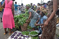 Archivo:Women in a market selling vegetables2