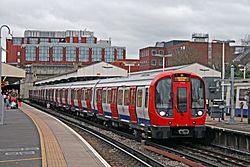 London Underground S7 Stock 21360 on District Line, Wimbledon (16081398792).jpg