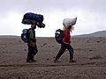 Helpers carrying loads on their heads on Mt Kilimanjaro