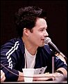 Johnny Yong Bosch at microphone
