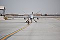 A U.S. Airman with the 451st Air Expeditionary Group motions to an MQ-9 Reaper unmanned aerial vehicle after the aircraft returned to Kandahar Airfield, Afghanistan, March 20, 2014 140320-F-YY948-032