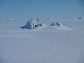 Mountain Peaks, Thurston Island, Antarctica (15572629748).jpg