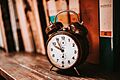 Old alarm clock on the bookshelf - 50233824038
