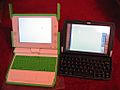 OLPC XO next to a Psion Netbook 3
