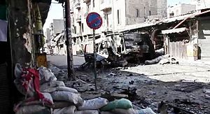Archivo:Bombed out vehicles Aleppo