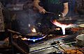 Wok cooking and fire by romainguy