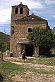 Persona caminando junto a la iglesia de ibort (6132875786)
