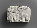 Relief plaque, upper part of crocodile-headed god MET DP236820