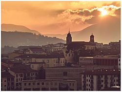 Campanile del Duomo e Torre dell'Orologio al tramonto.jpg